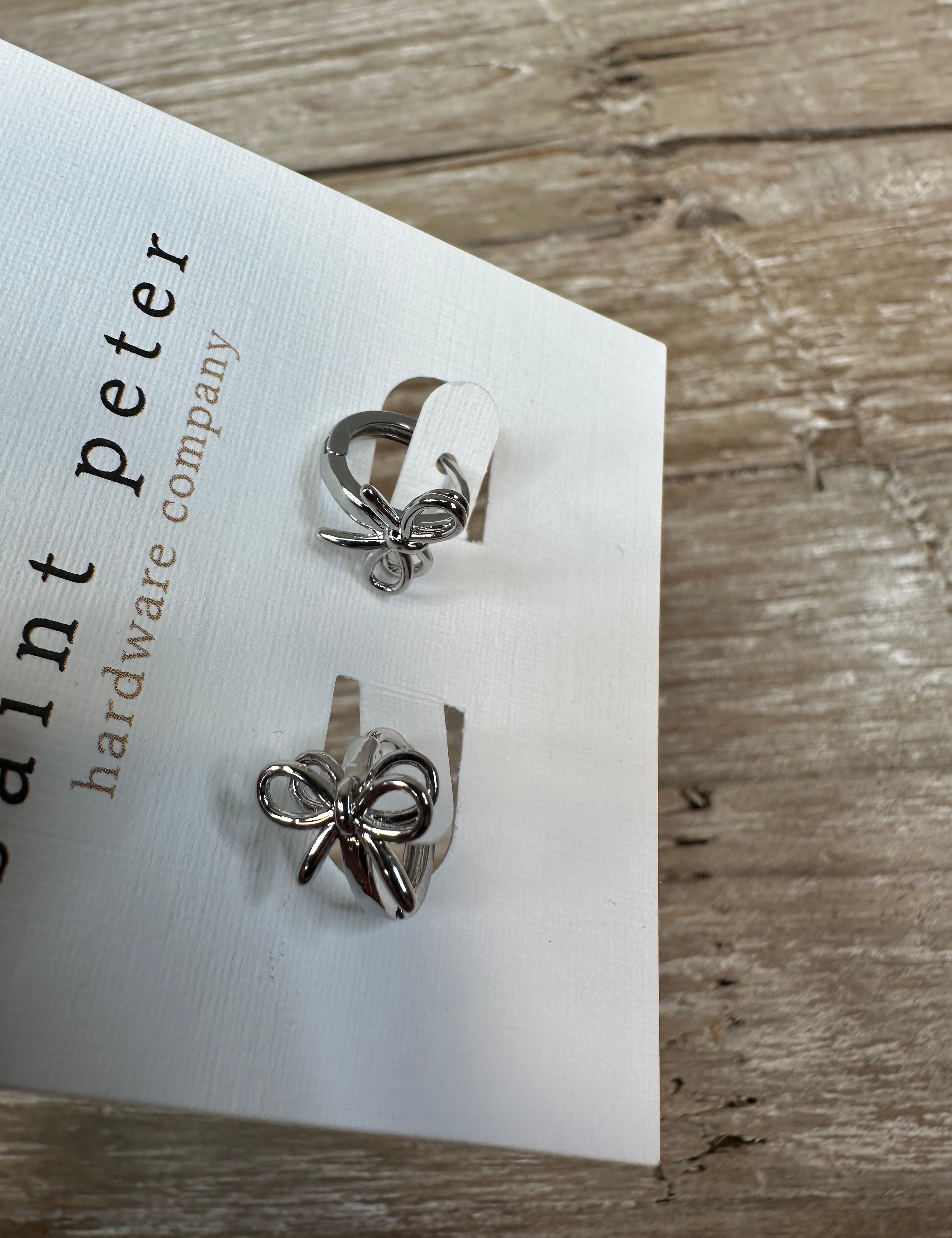 Silver Bow Huggie Earrings Jewelry - Earrings St. Peter Hardware