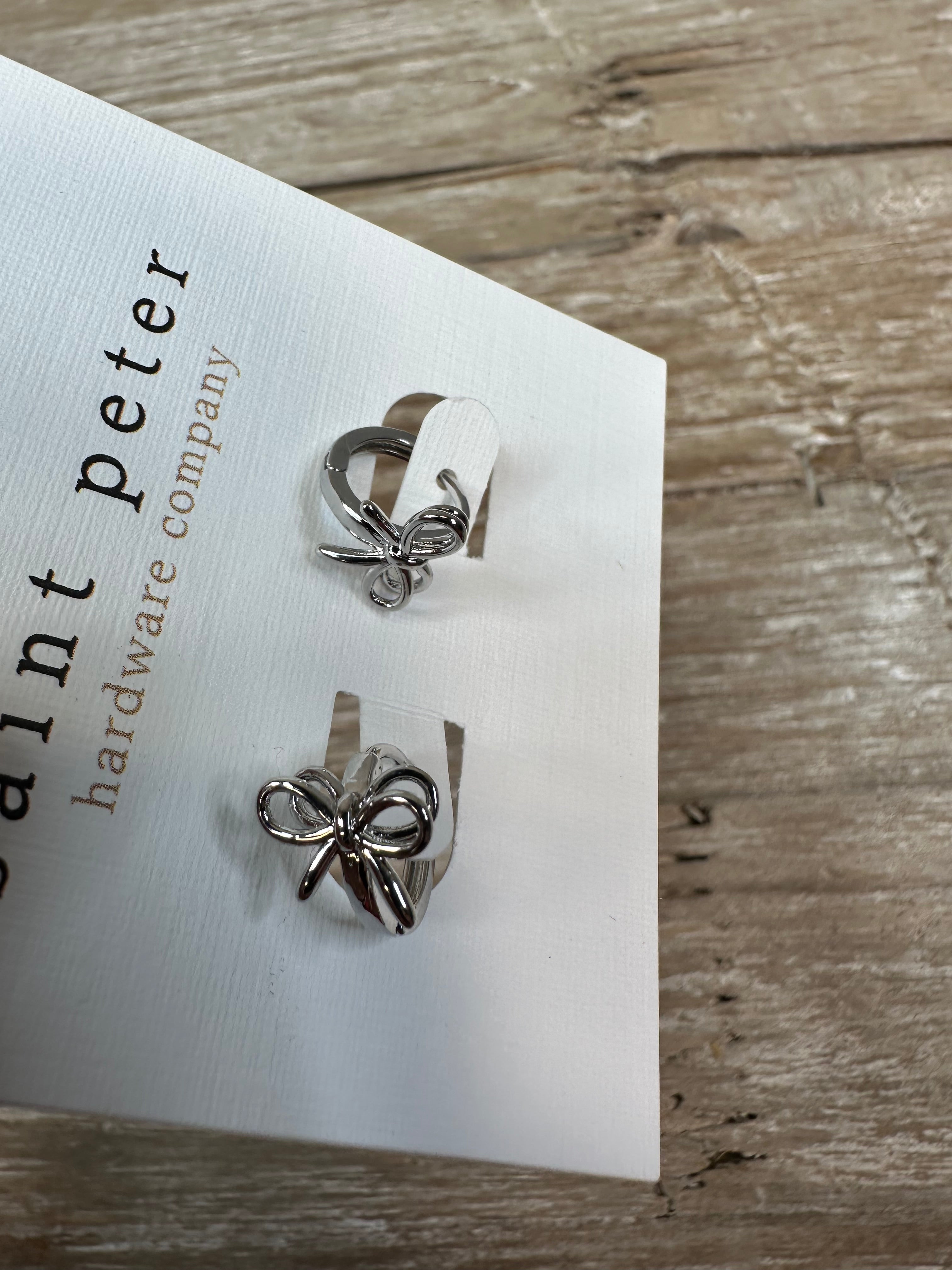 Silver Bow Huggie Earrings Jewelry - Earrings St. Peter Hardware